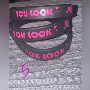 Black and Pink 'You Lock' Bracelets